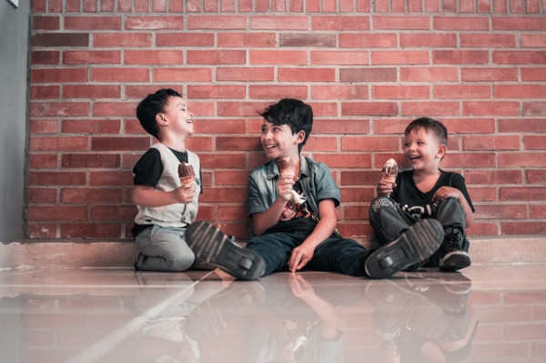 photo of boys sitting on floor 3654176