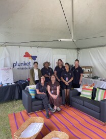 Team photo inside tent