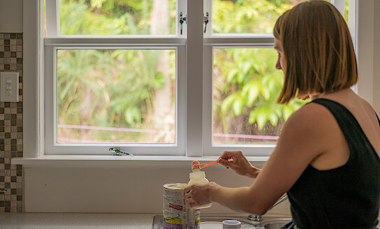 plunket formula feeding mum preparing bottle